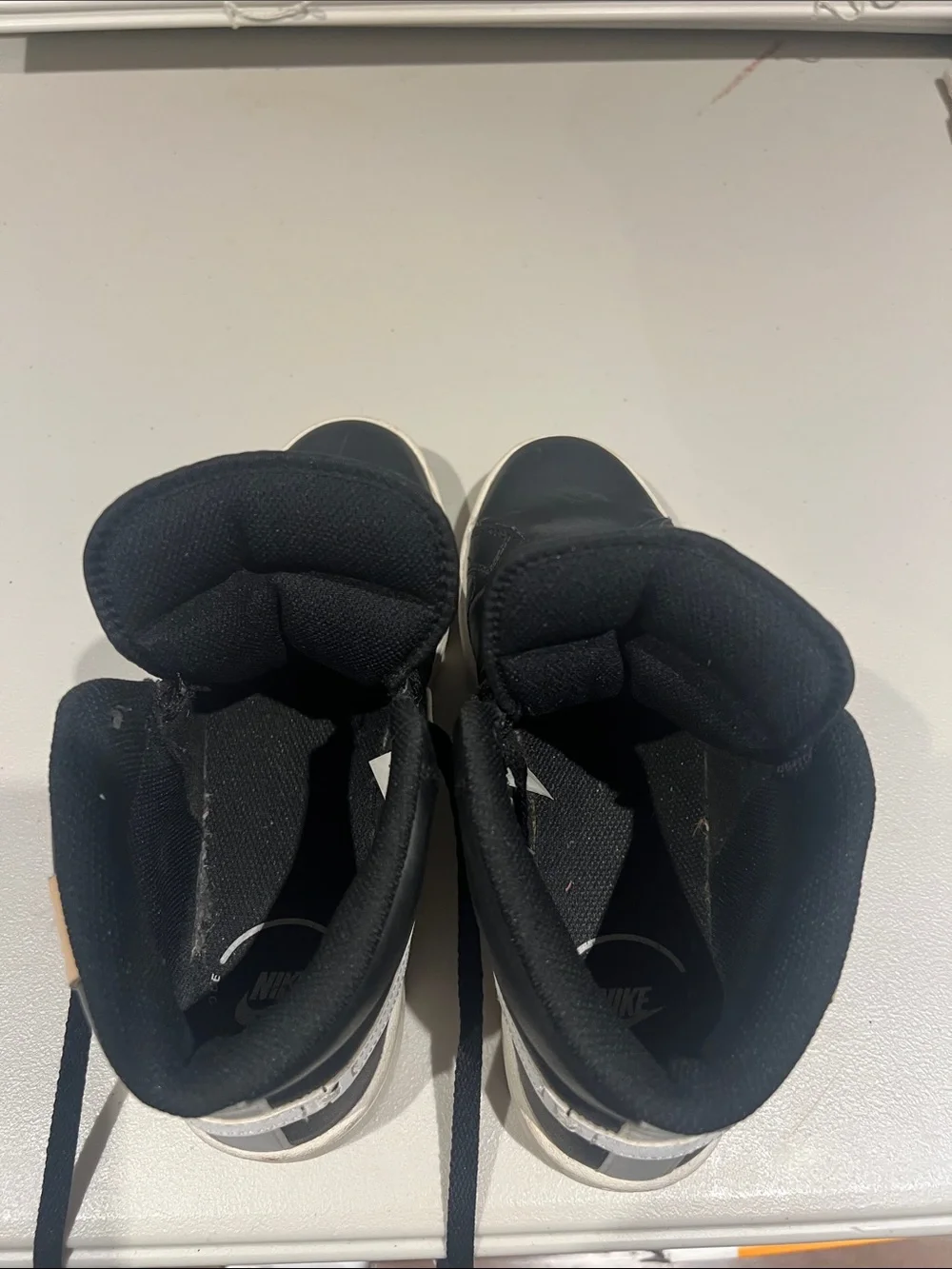 Nike Black High-Top Sneakers with White Soles and White Tongue Logo